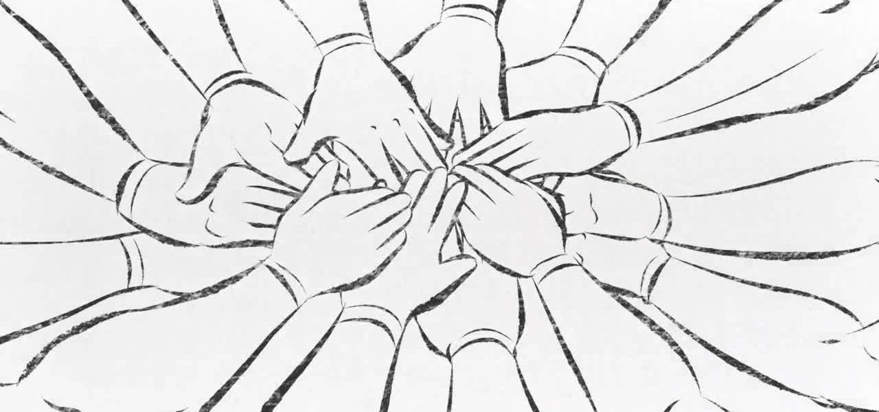 Hands stacked on top of each other in a huddle