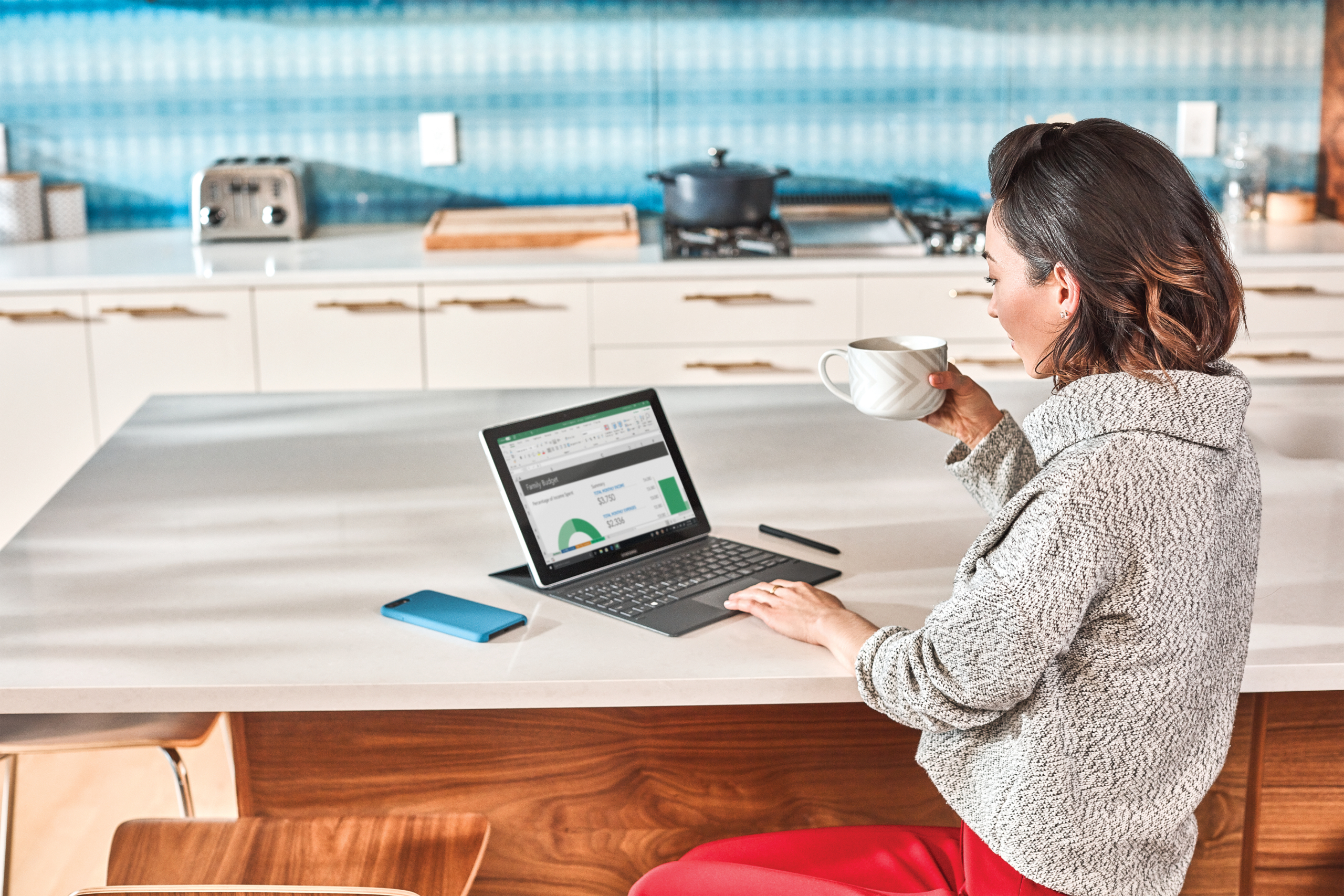 Woman interacting with Samsung GalaxyBook laptop