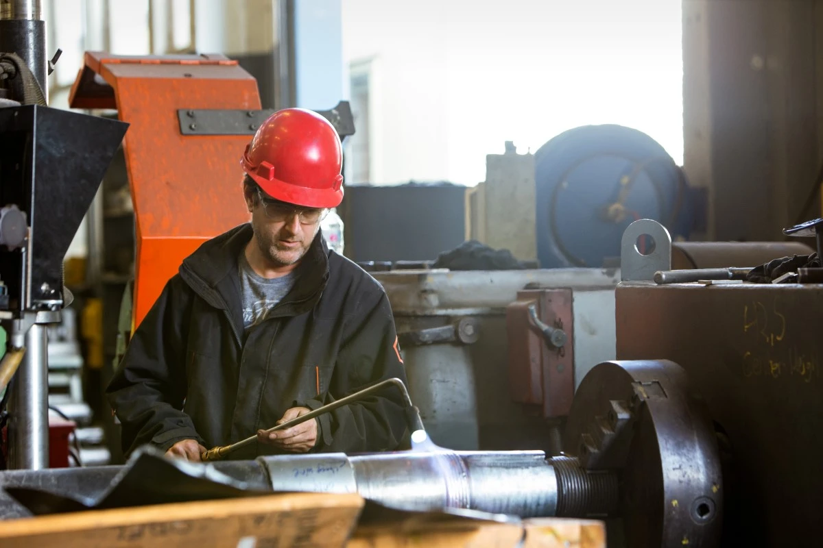 Male worker welding in the shop; manufacturing environmental image