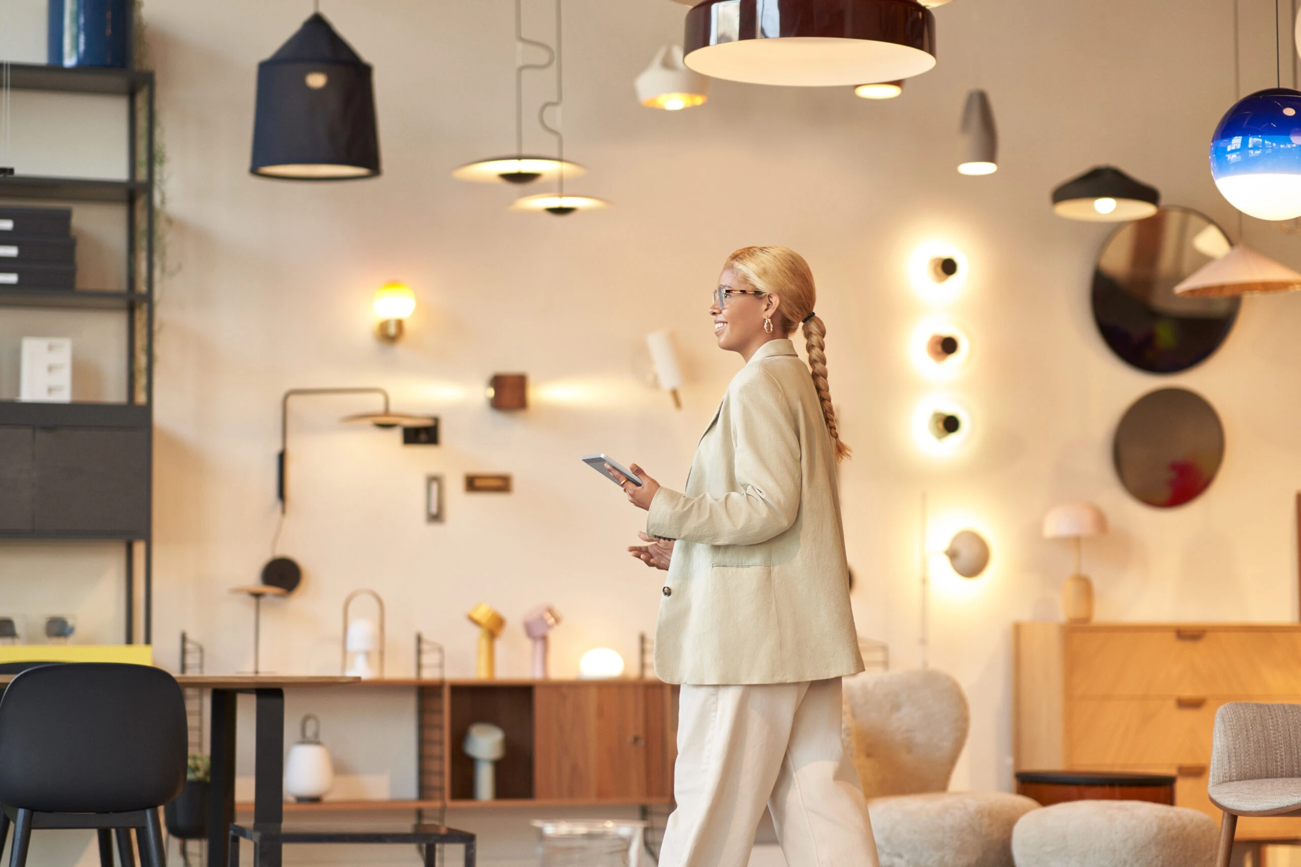 Person in retail store holding device