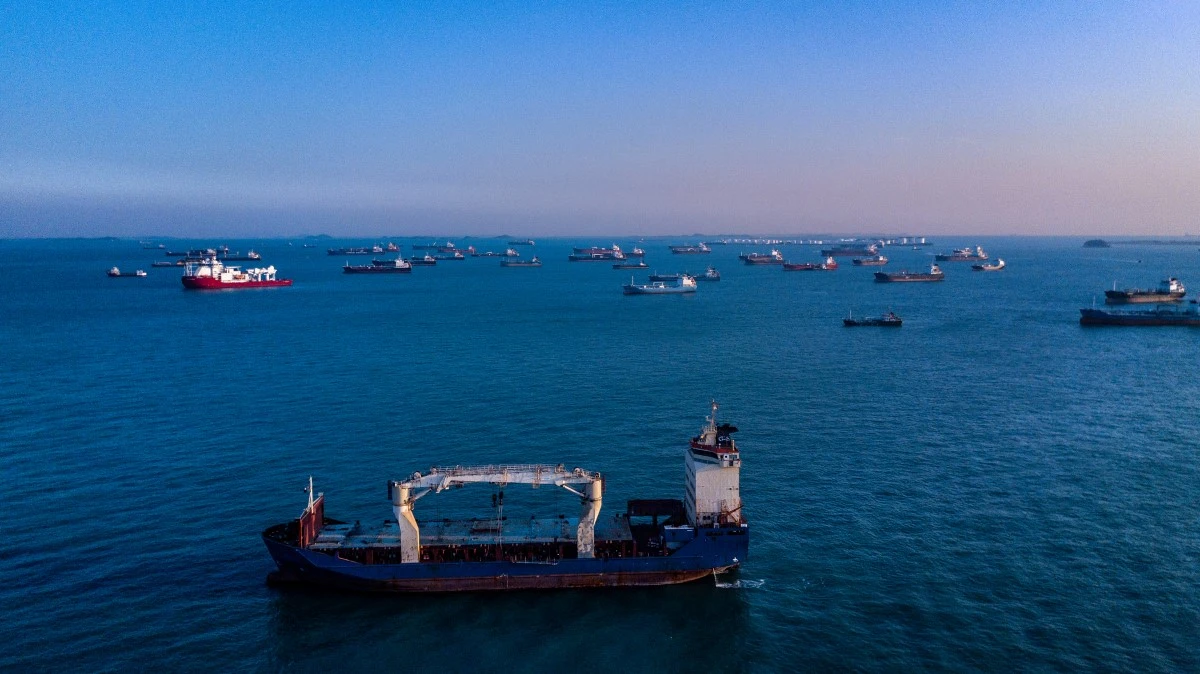 Aerial view of cargo ships waiting offshore to dock in Singapore harbor