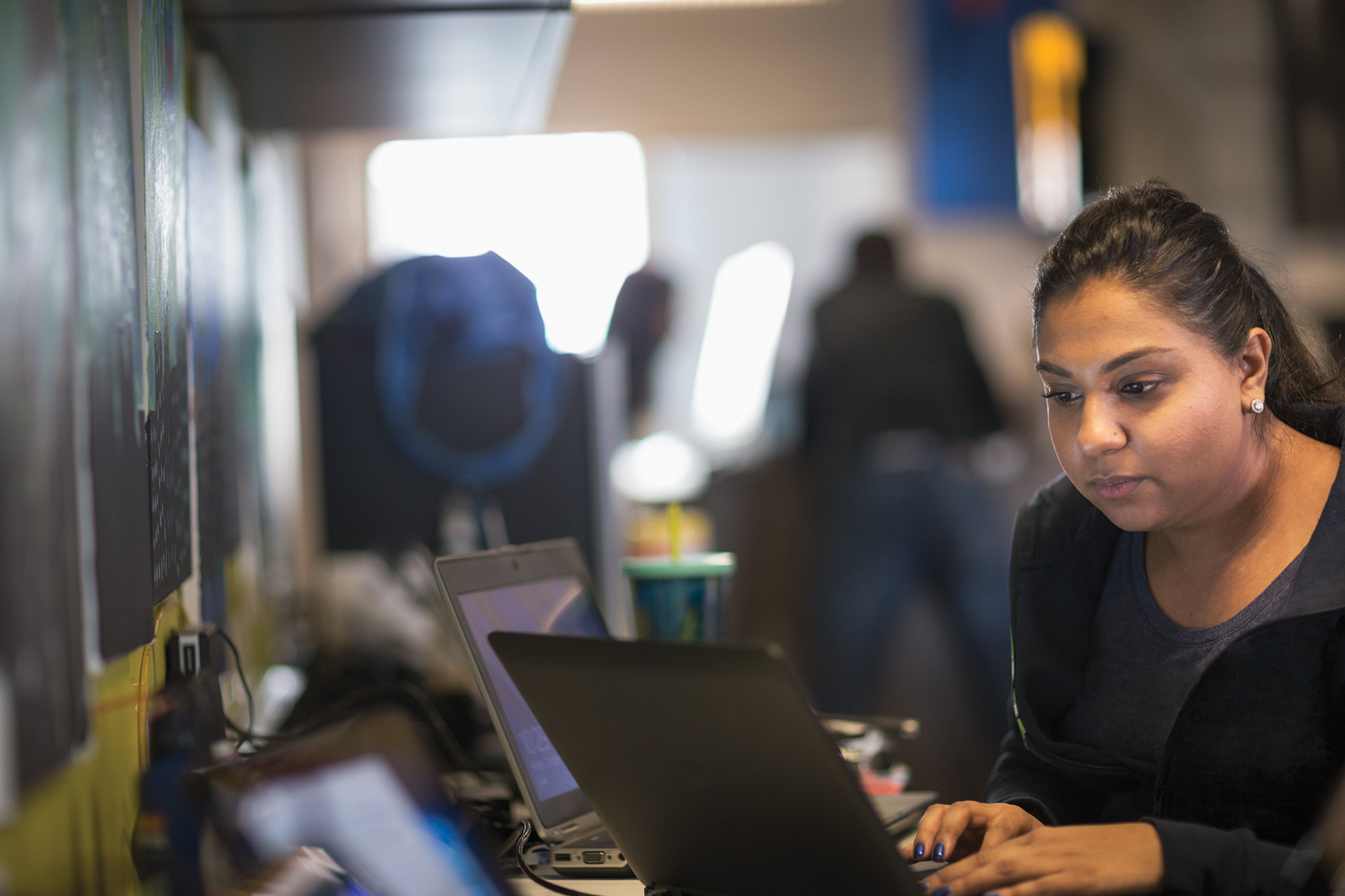 Photo of IT professional working on a laptop computer