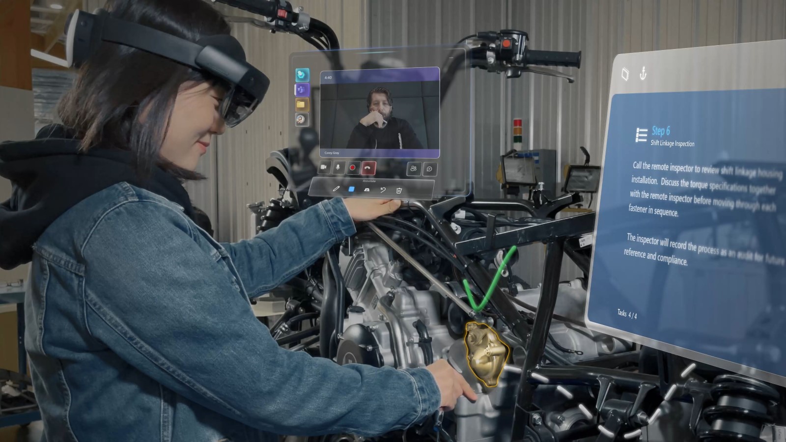 A technician works on a machine using HoloLens to follow instructions and to conduct an inspection meeting with a live video feed showing a remote inspector approving the work