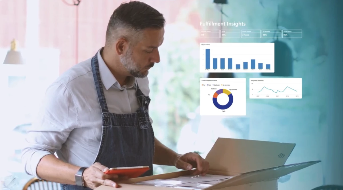 A man holds a tablet and looks into a cardboard box. An overlay of fulfillment insights fills the right of the image