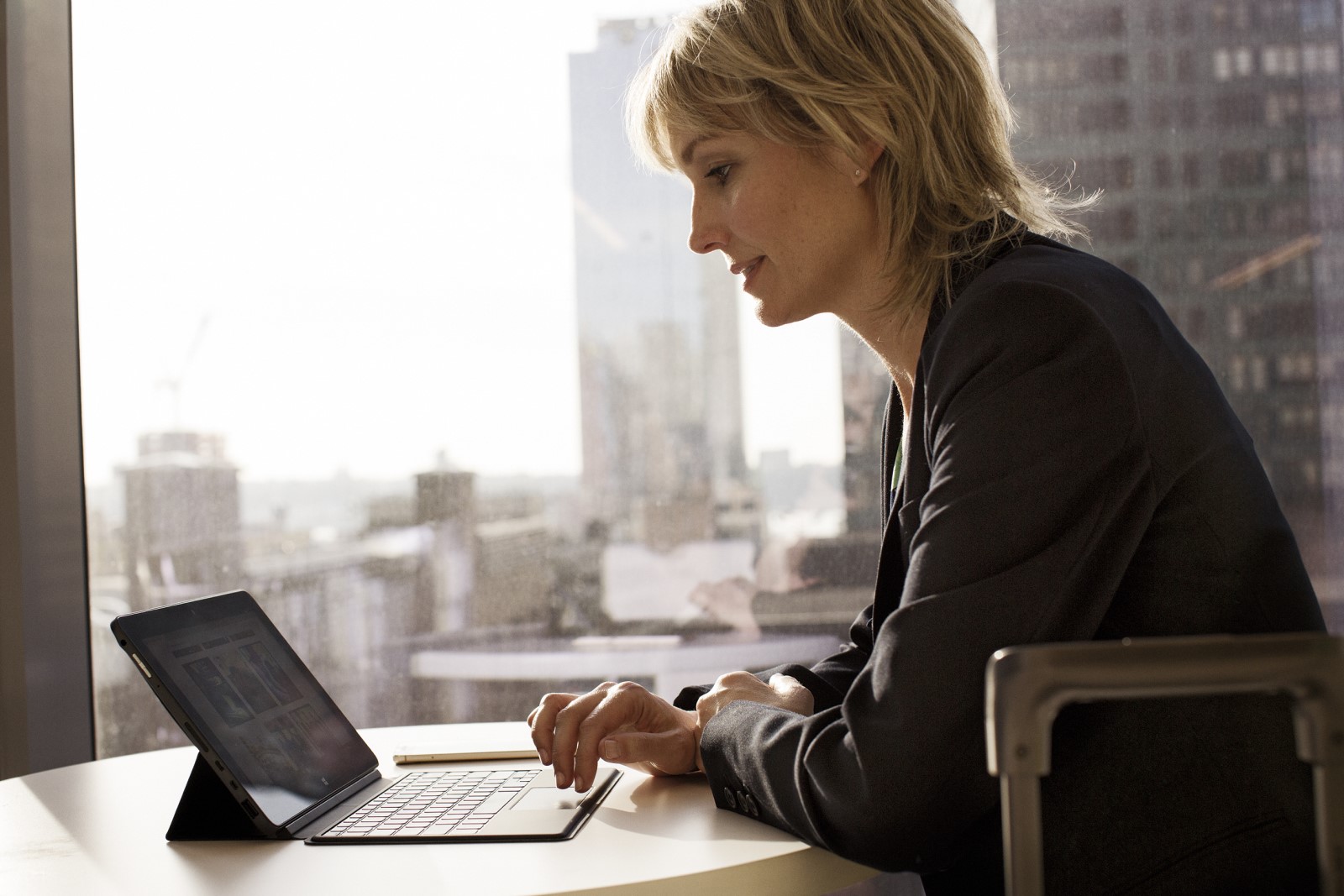 Business woman in remote office working on laptop