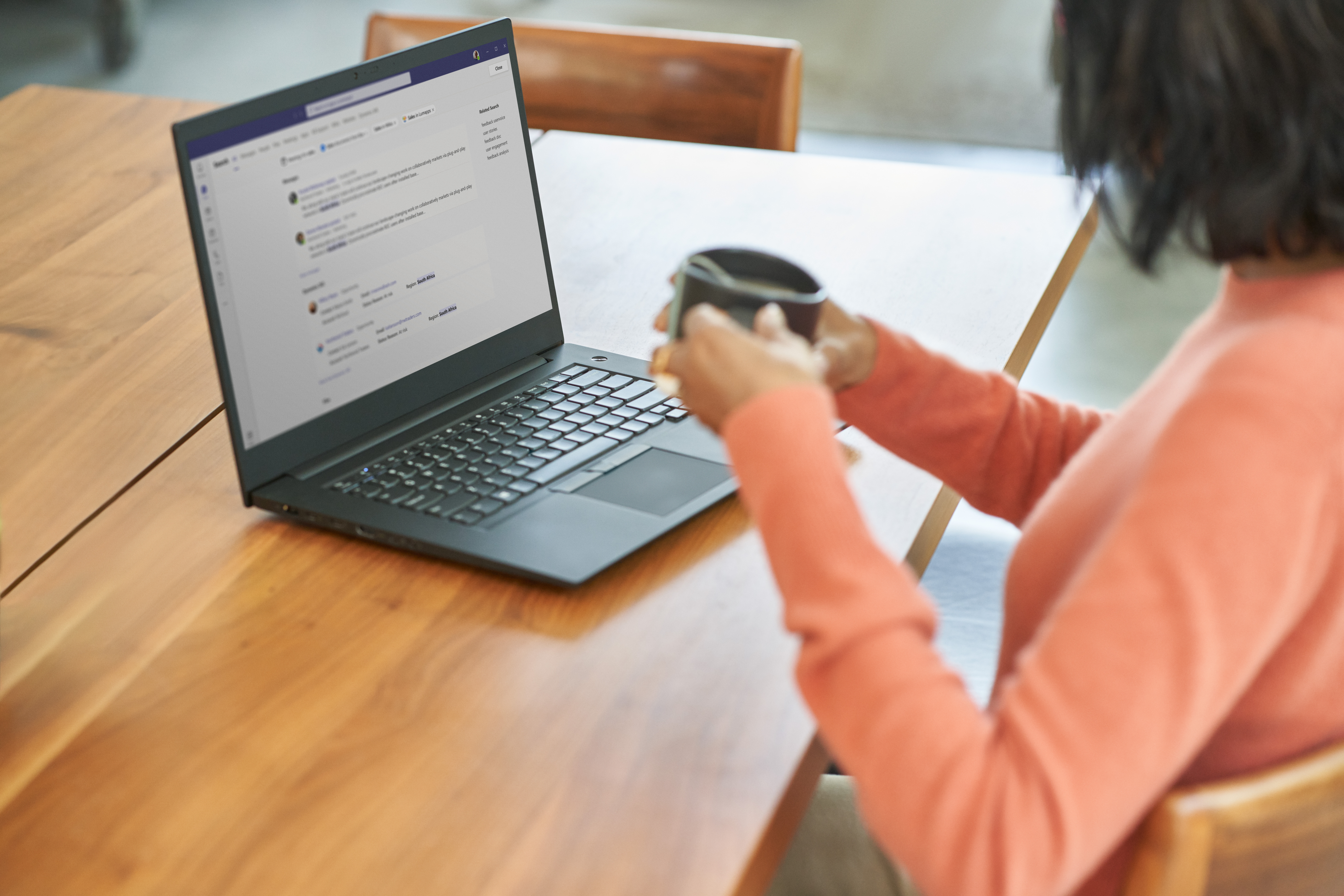 Business decision maker (BDM) working from home on a laptop while showing a positive security posture
