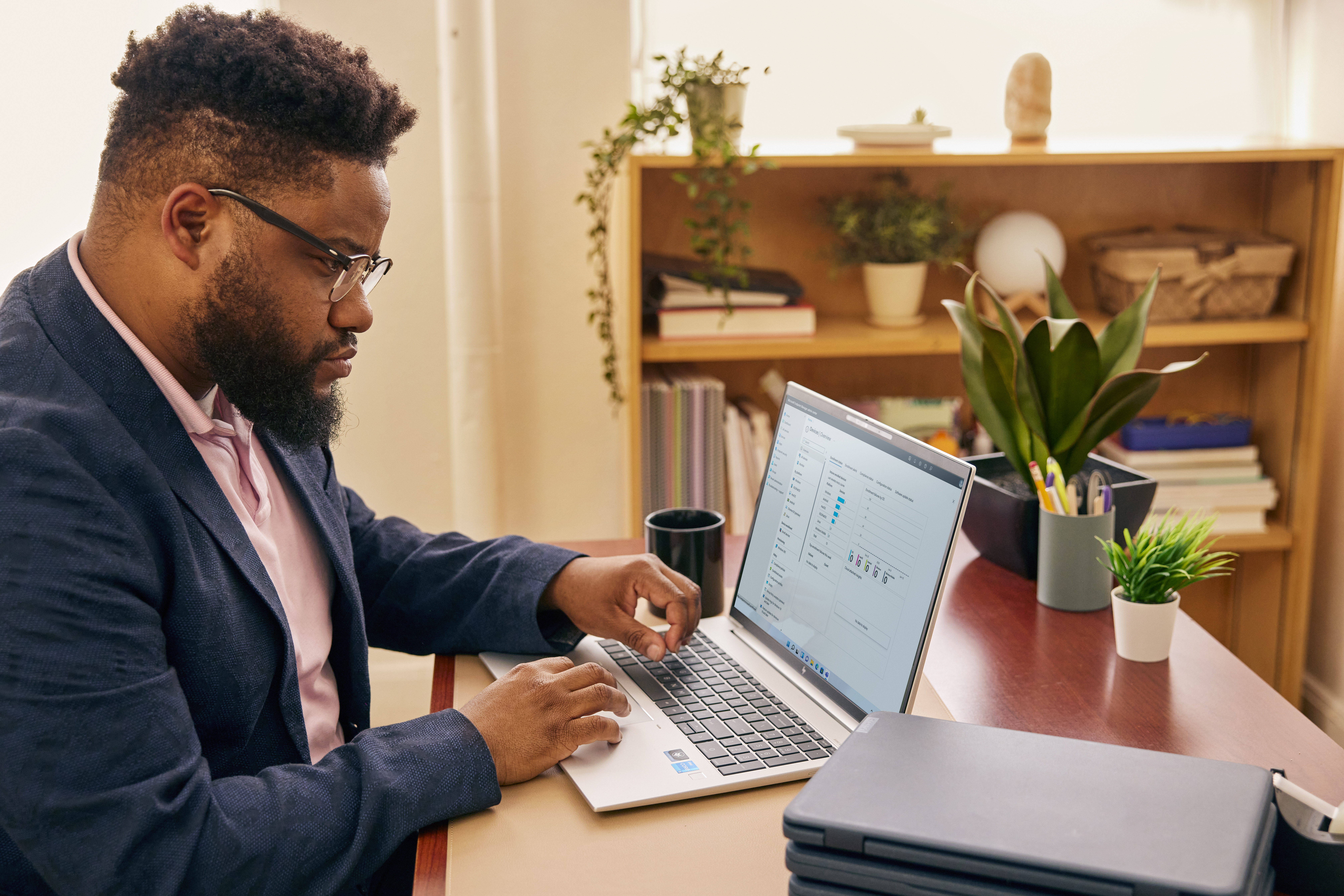 Person sitting at a desk working on their computer