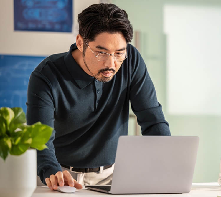 A person looking at a laptop