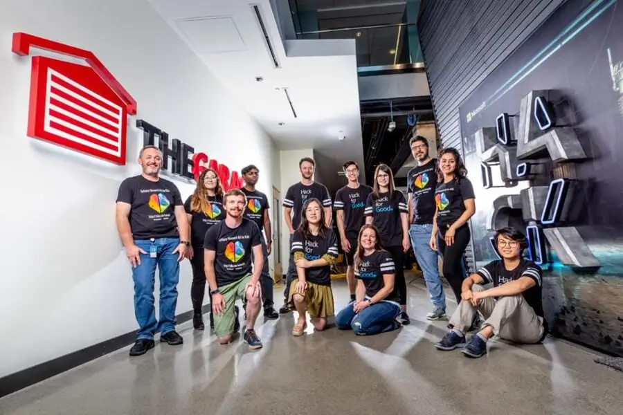 A winning Hackathon team poses for a photo in The Garage Redmond