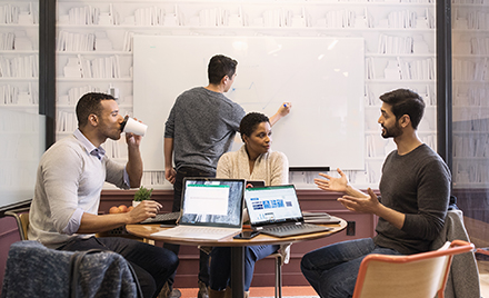 Image of a small worker gathering in a conference room