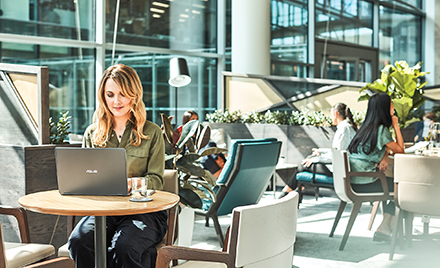 Image of a woman working at her office