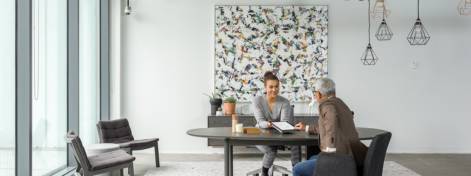 Two Firstline Workers interact with one another over a table