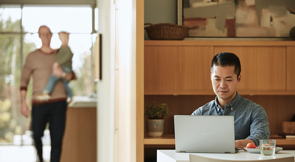 Image of a father working from home