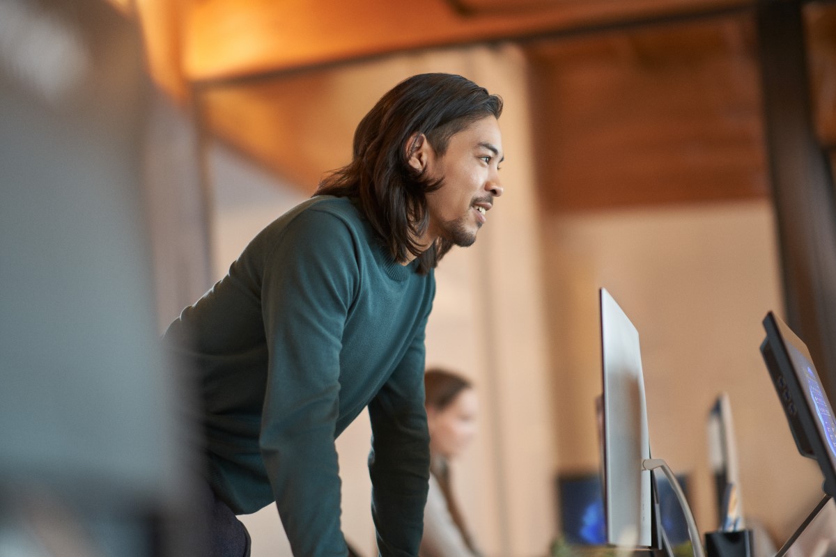 Individual at work showing a positive facial expression