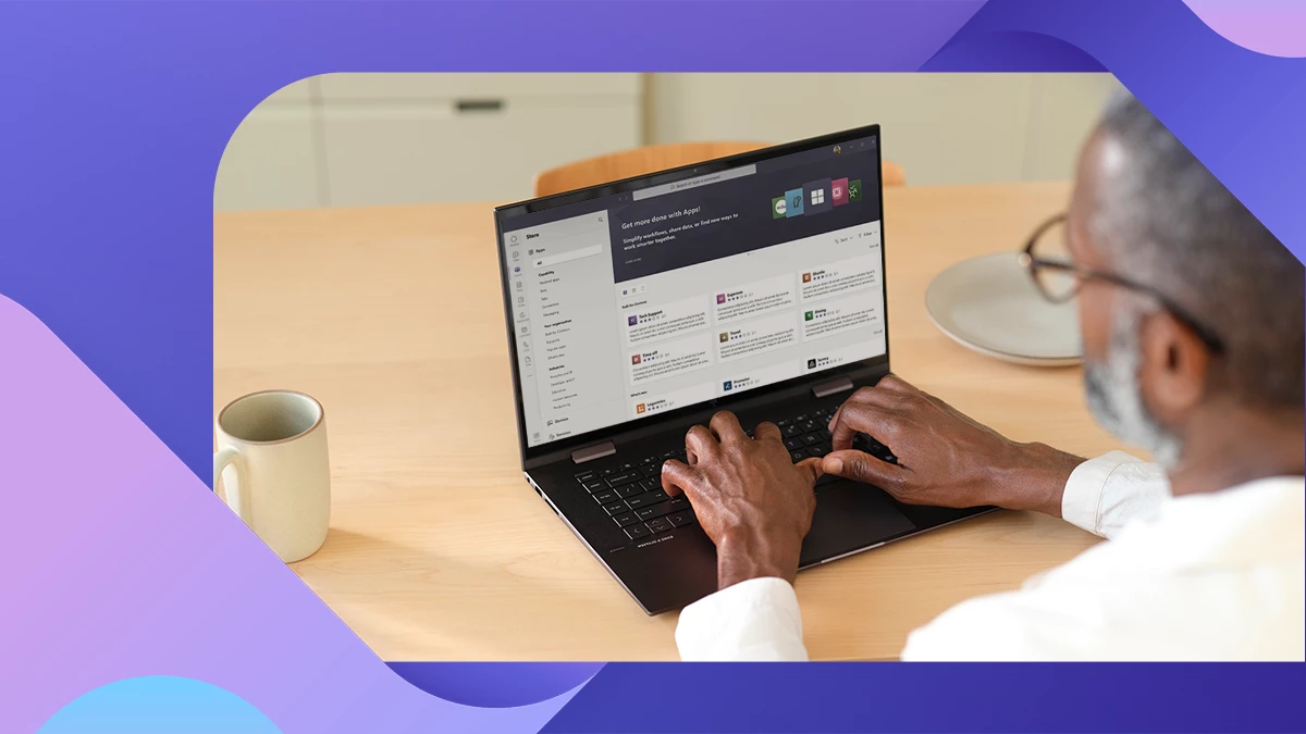 A person working on a laptop showing the app store in Microsoft Teams