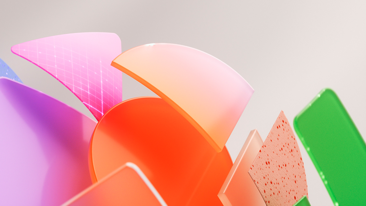 Colorful, geometric shapes appearing to float upward from the bottom left corner