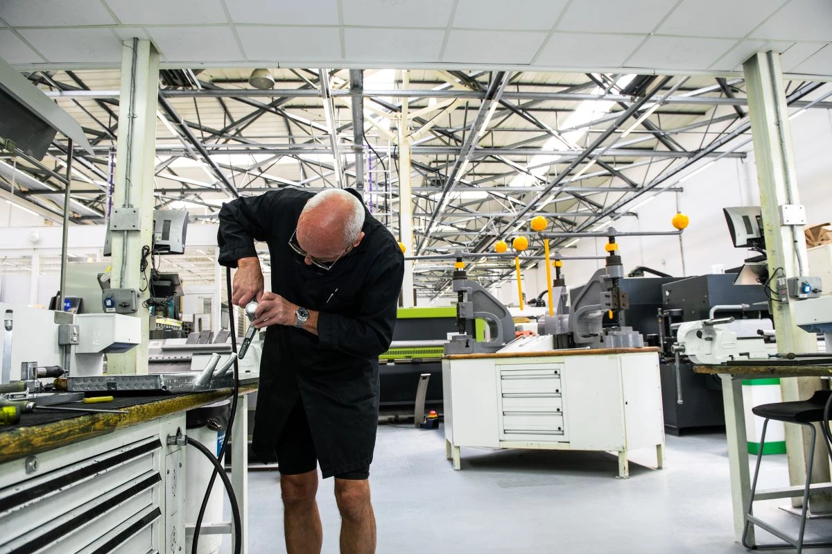 Race car parts are hand-crafted at a Formula One manufacturing plant