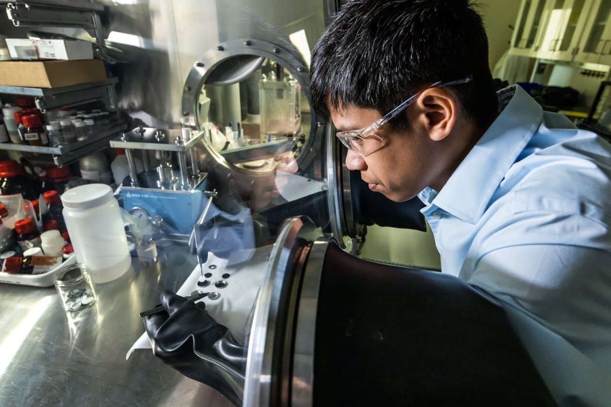 Dan Thien Nguyen, a PNNL materials scientist, assembles a coin cell with the synthesized solid electrolyte
