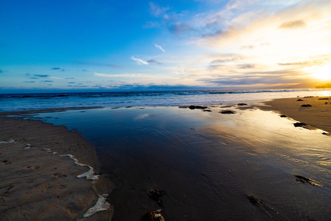 Sunset along an intertidal zone on the Pacific Ocean
