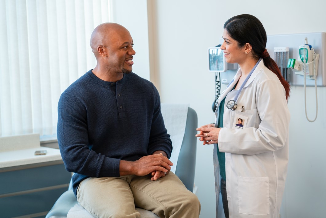 a doctor talking to a patient in the exam room
