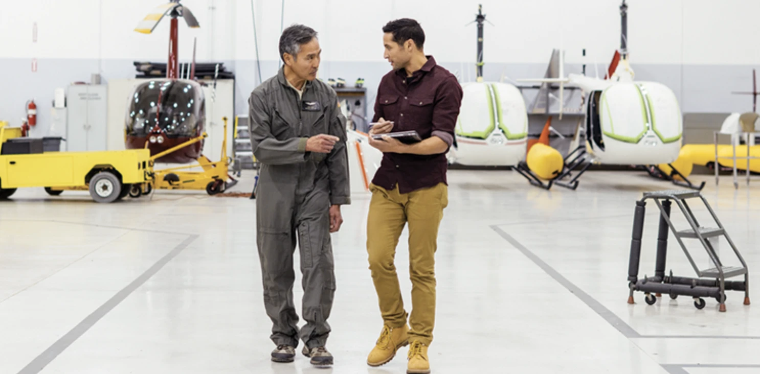 two men at a manufacturing site