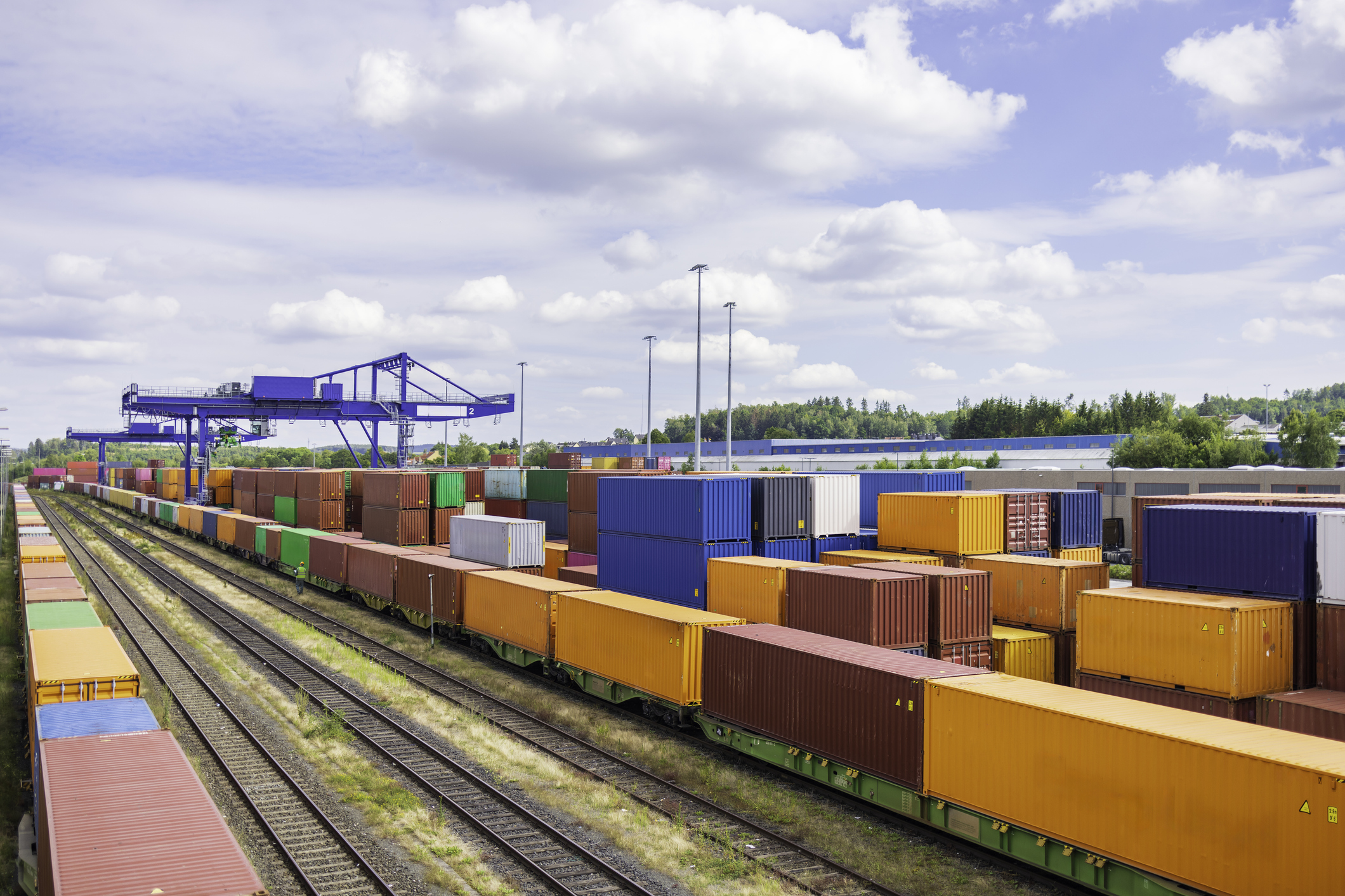 Shipping containers on freight rail