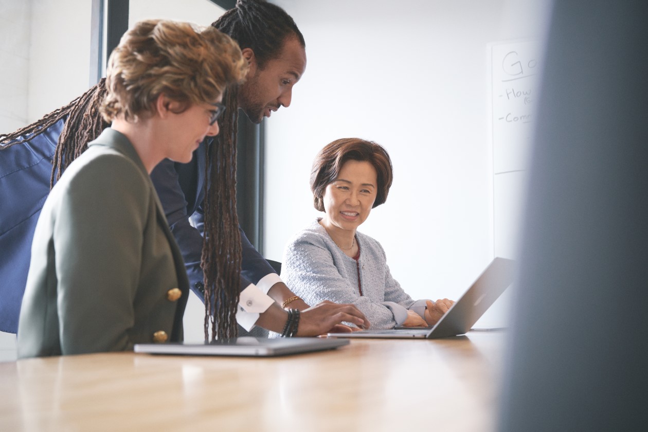 Satisfied executive customer working and collaborating with investment advisor on investment decisions using intelligent apps powered by Azure