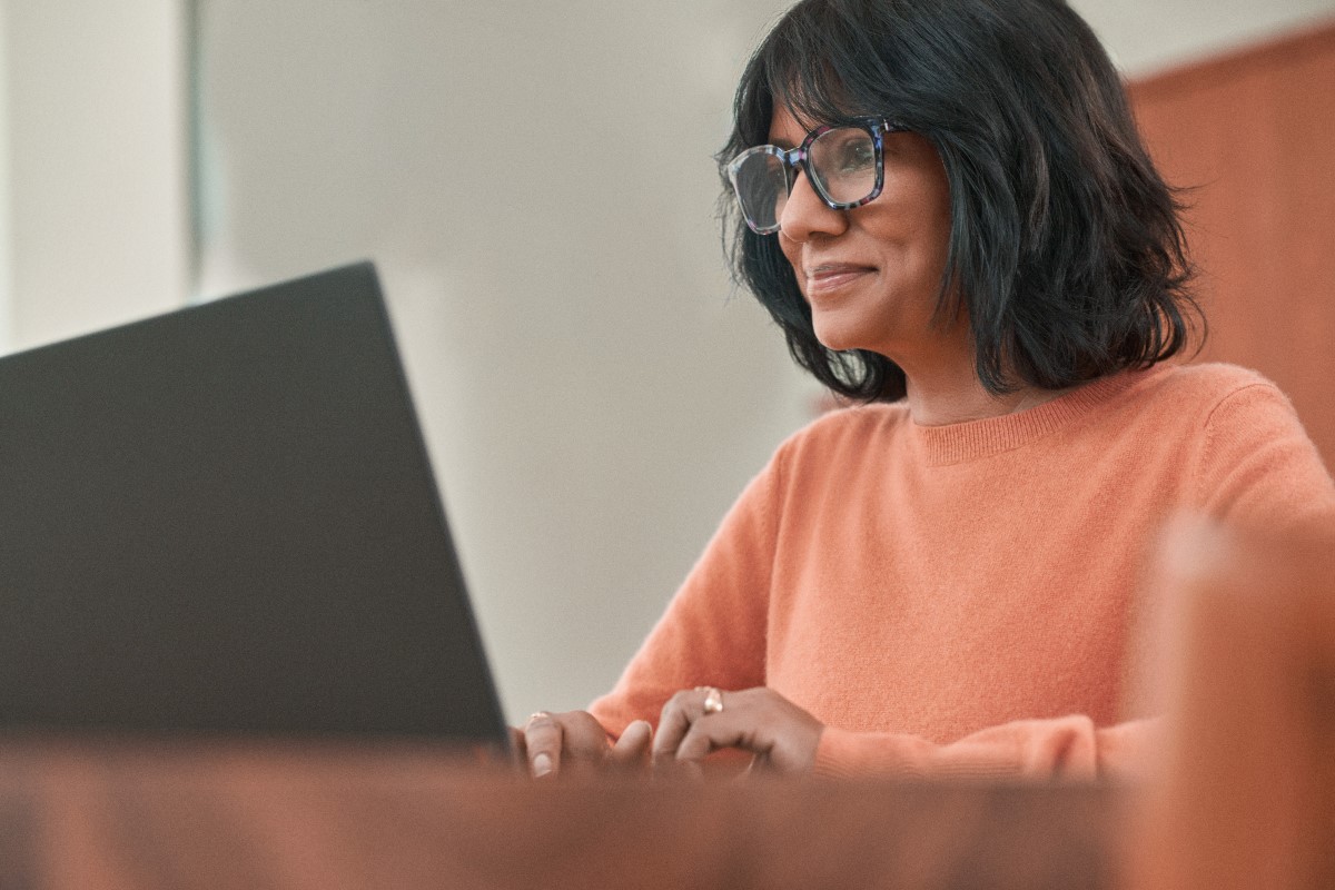 Woman working from home at her laptop