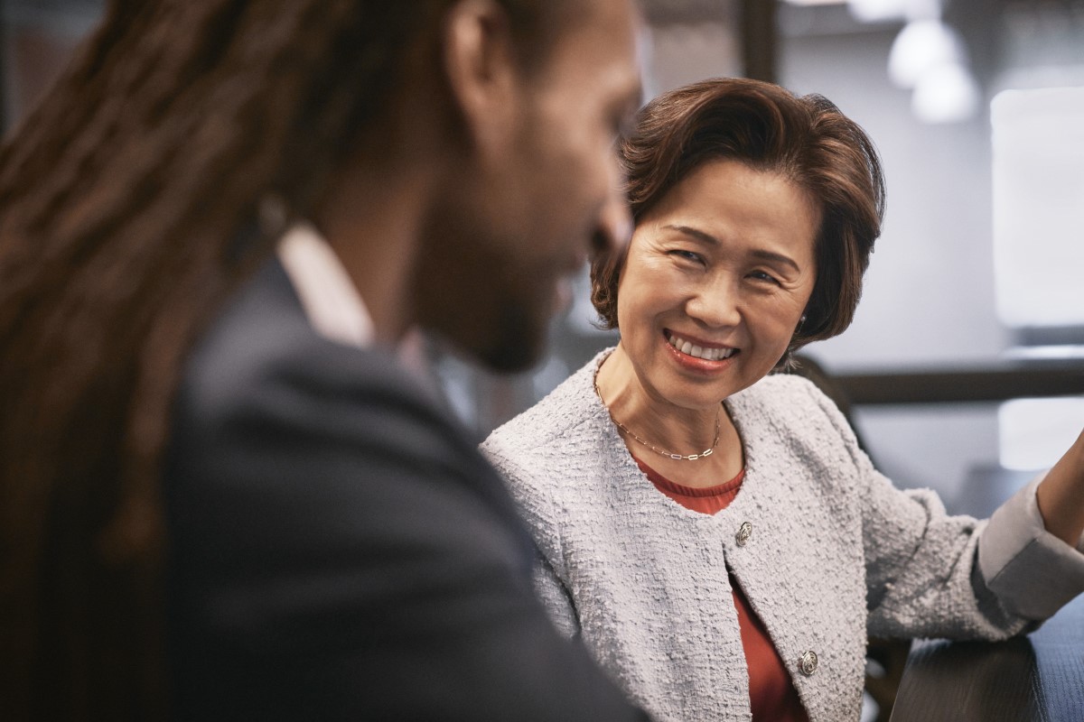 Satisfied executive customer working with investment advisor on investment decisions