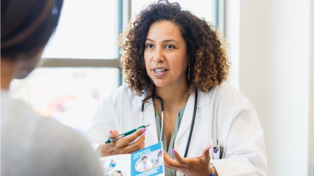 image of a nurse and patient reviewing a brochure