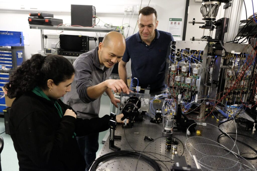 Kaoutar Benyahya, Kai Shi and Paolo Costa – Microsoft researchers on the team that developed the new MicroLED cabling system – with one of the prototypes they used to develop the technology.