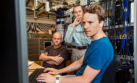 A group of tech workers checking out some suspicious code