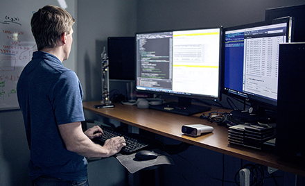 A man working at a PC workstation
