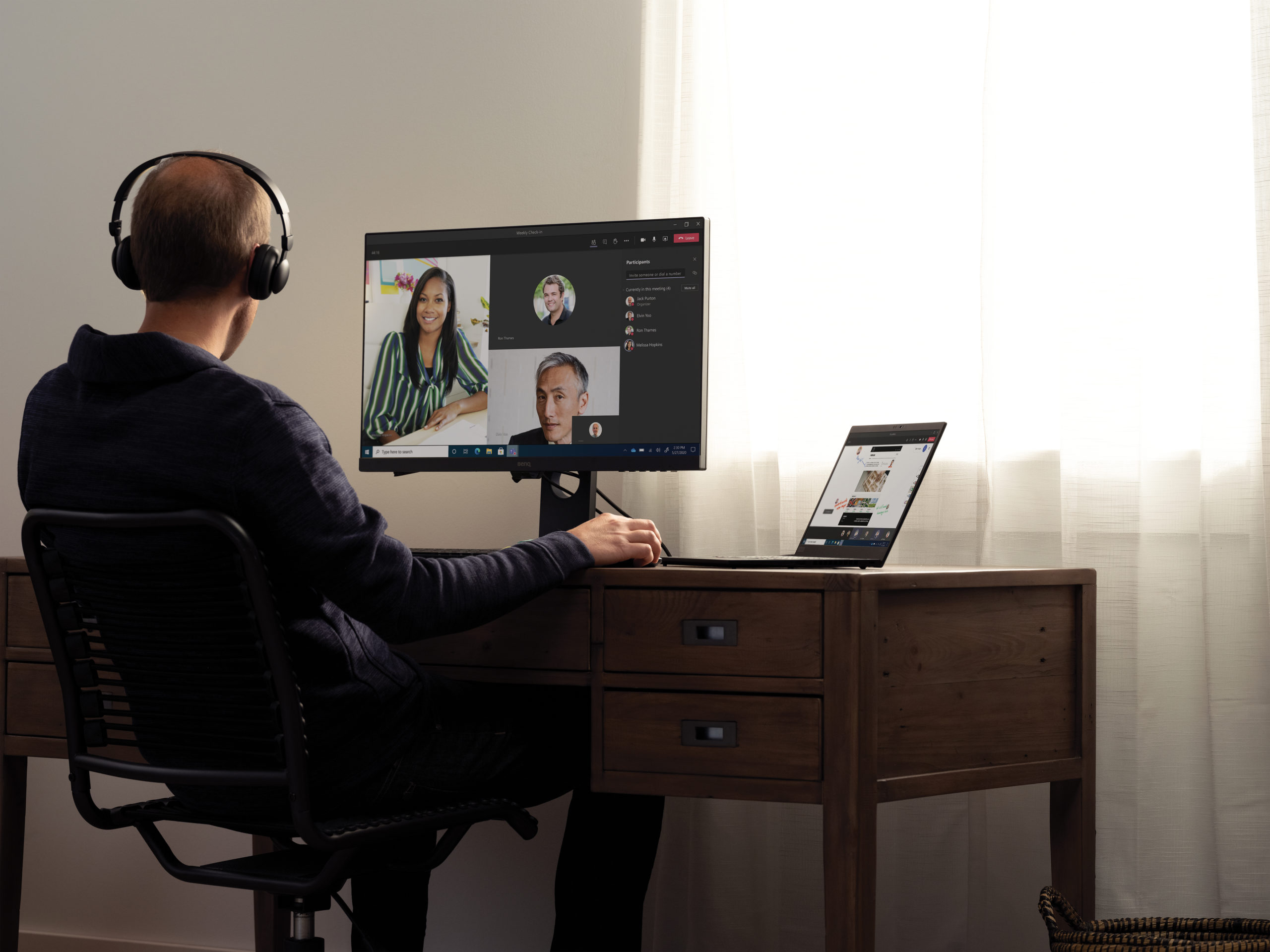 Teams call with headphones at a home desk on a Lenovo ThinkPad X1 Carbon