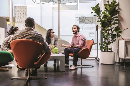 Image of workers in a meeting
