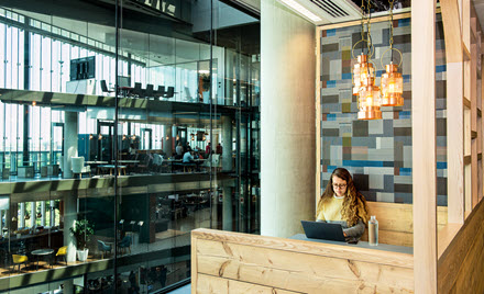 Image of a worker in a booth in a cafeteria