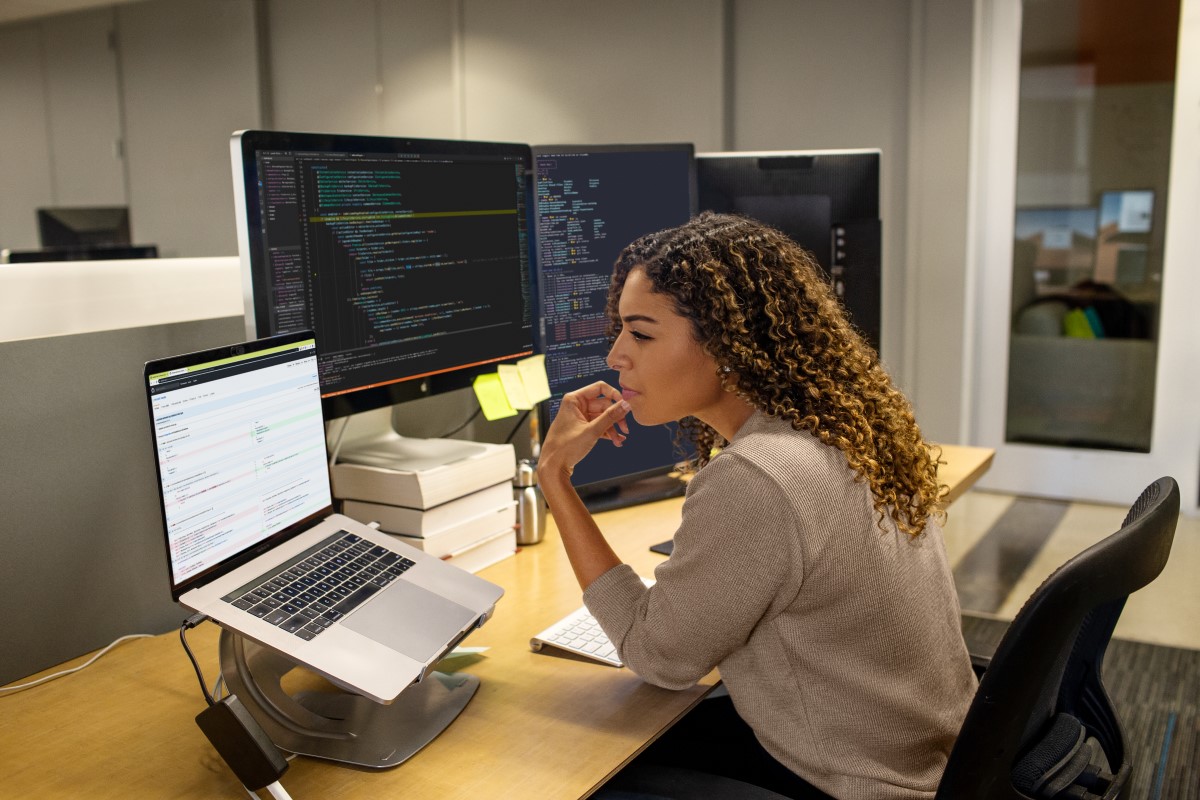 Black female developer working at enterprise office workspace