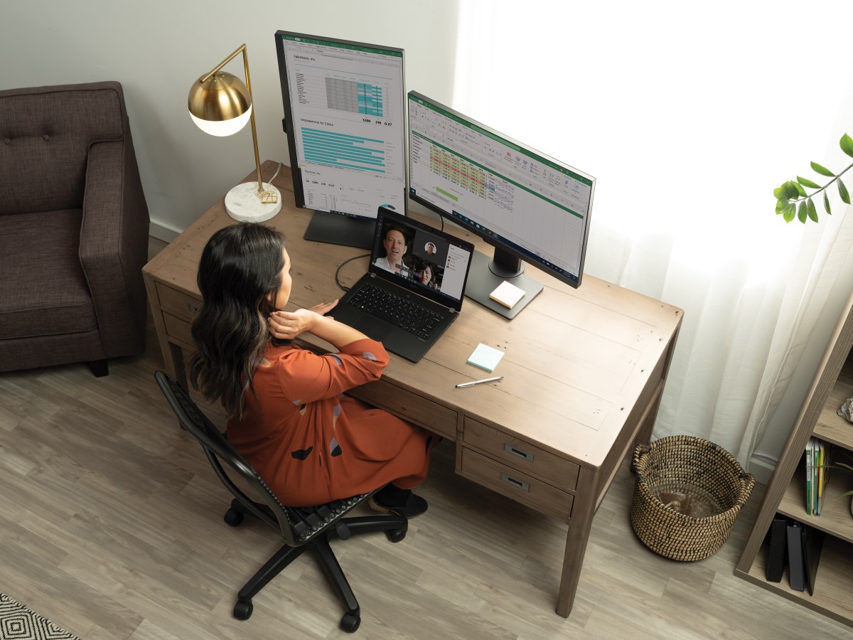 A woman having a Microsoft Teams in her living room home office on her Acer TravelMate P6