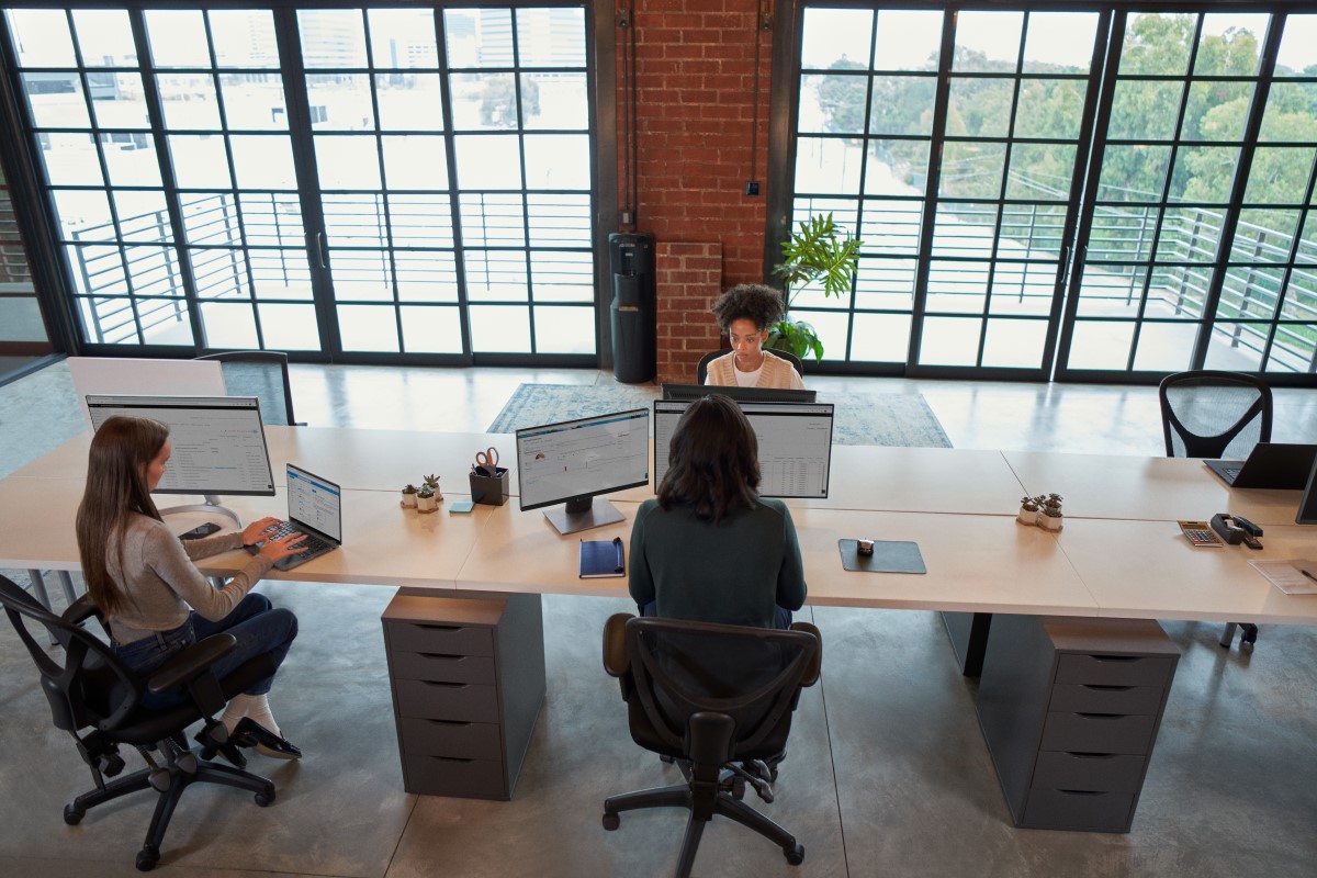 Enterprise office workers in focused work in an open work space