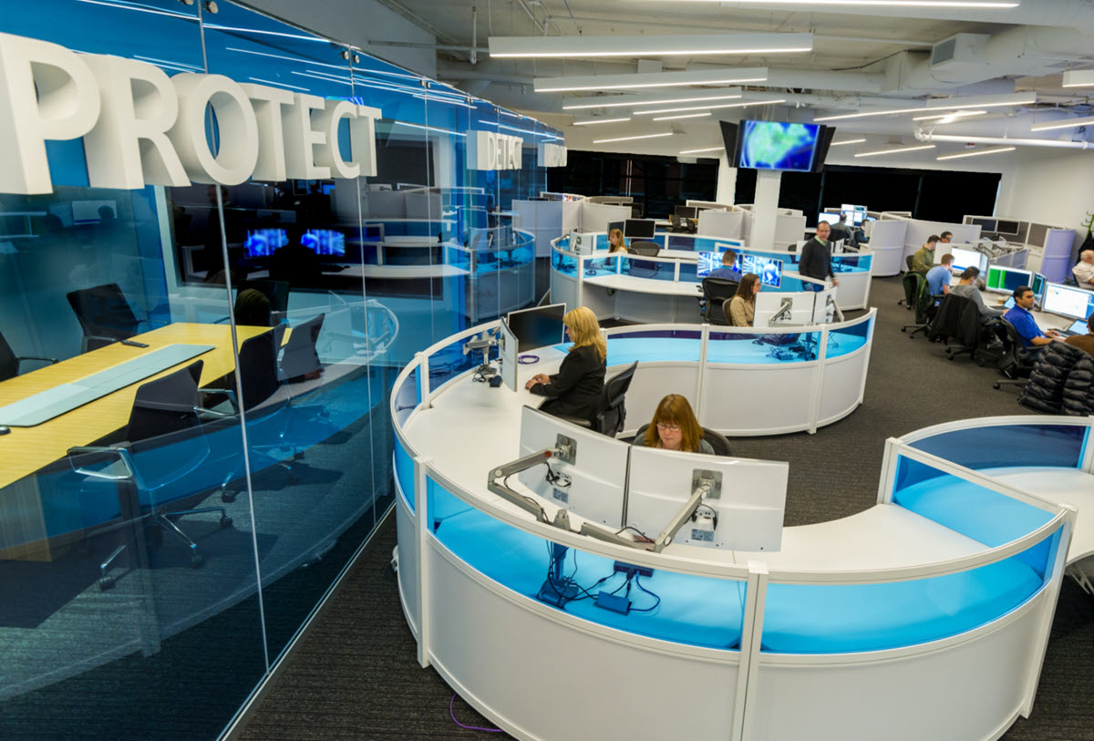 Photo of Microsoft Cyber Defense Operations Center with the word Protect in the foreground