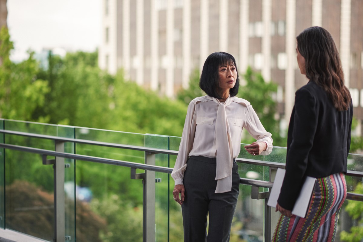 Two public service workers having a discussion at city hall