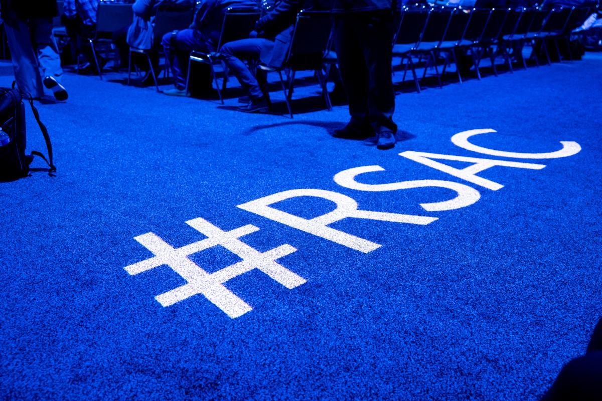 The floor at the RSA conference with the hashtag #RSAC projected onto the carpet