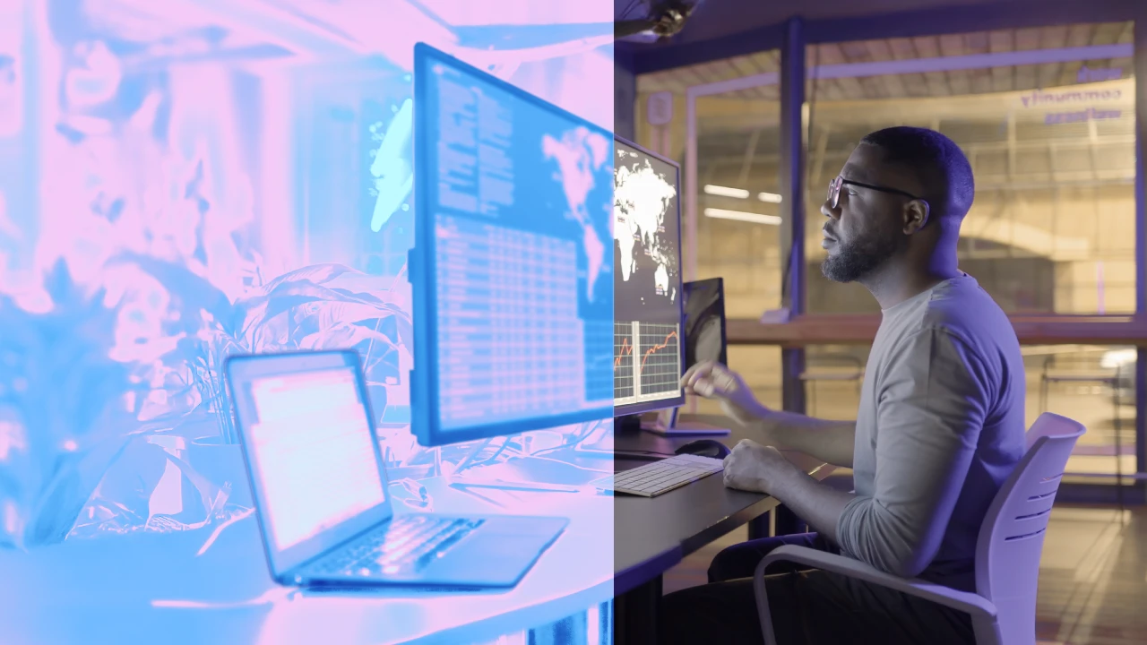 Person sitting at a desk looking at a computer screen