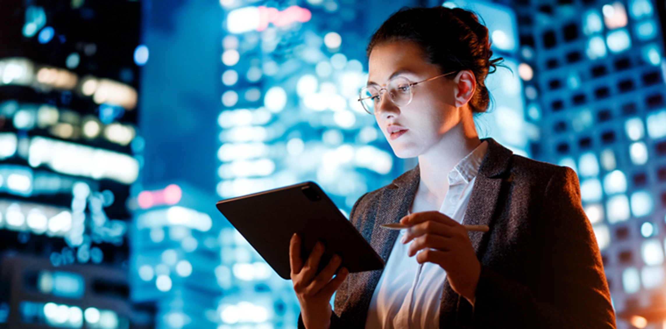 A woman holding a tablet computer