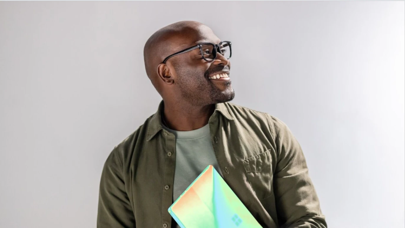 A man holding a laptop