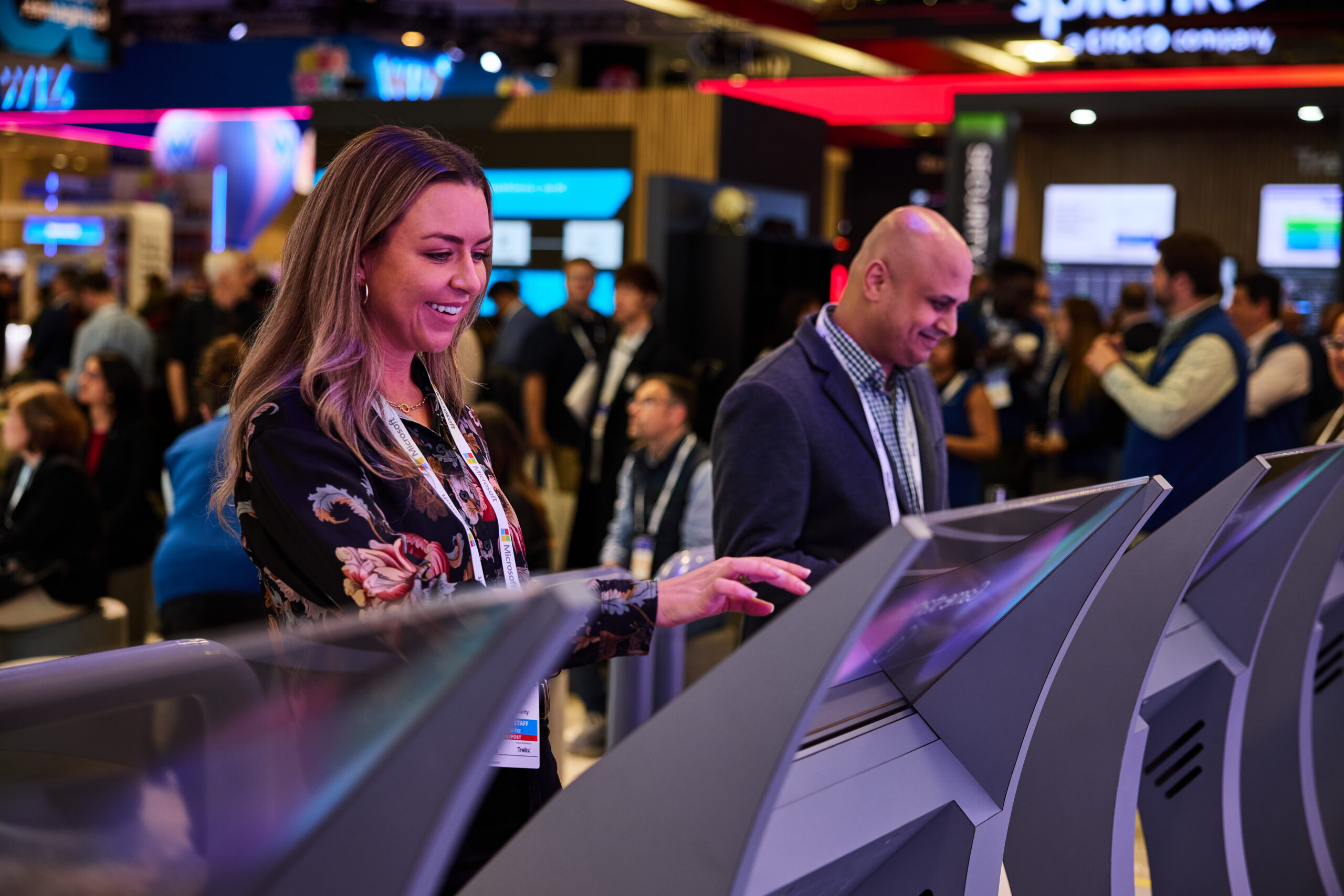 People interacting with touch screen at conference