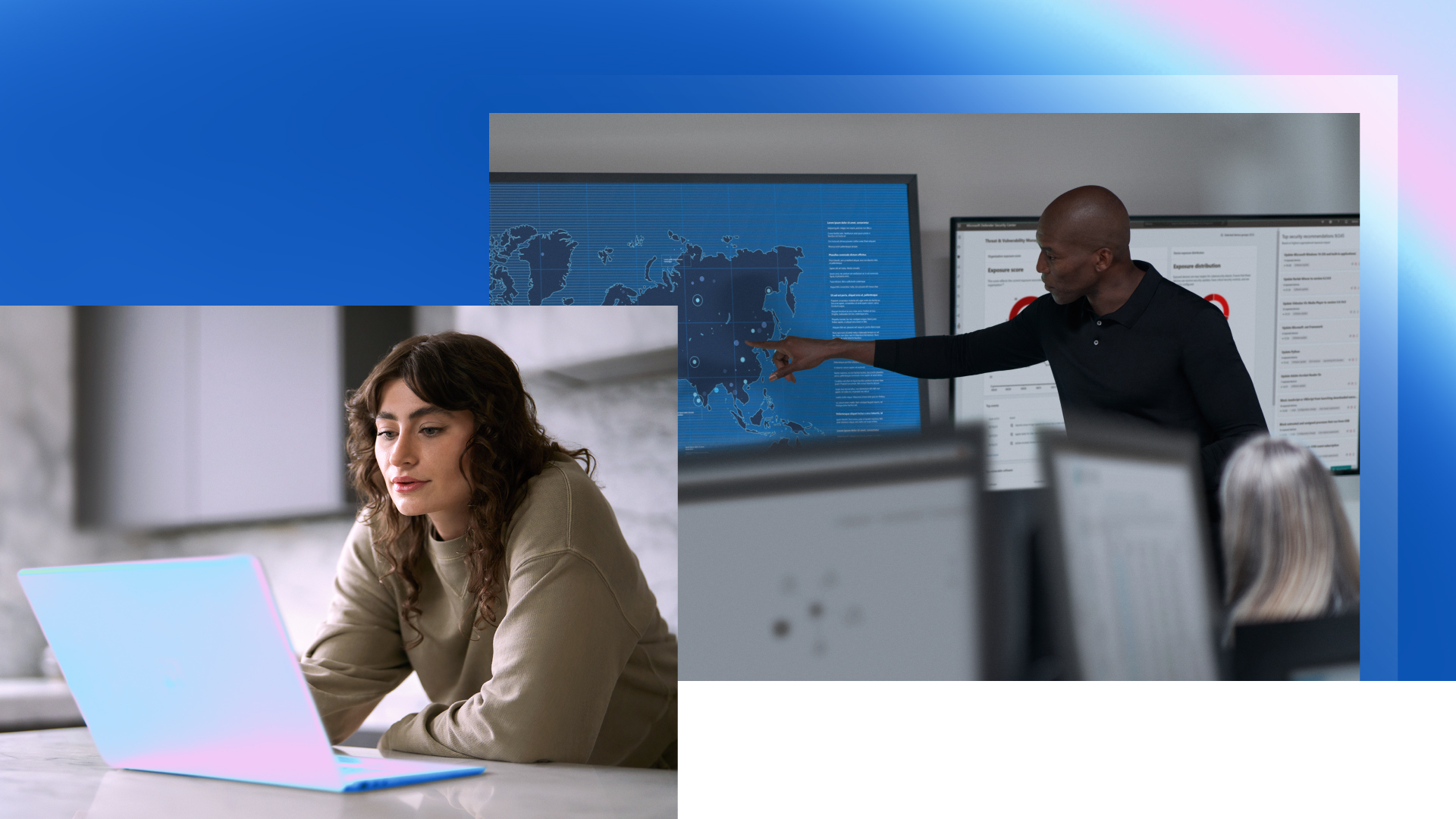 Two people points at computer screens