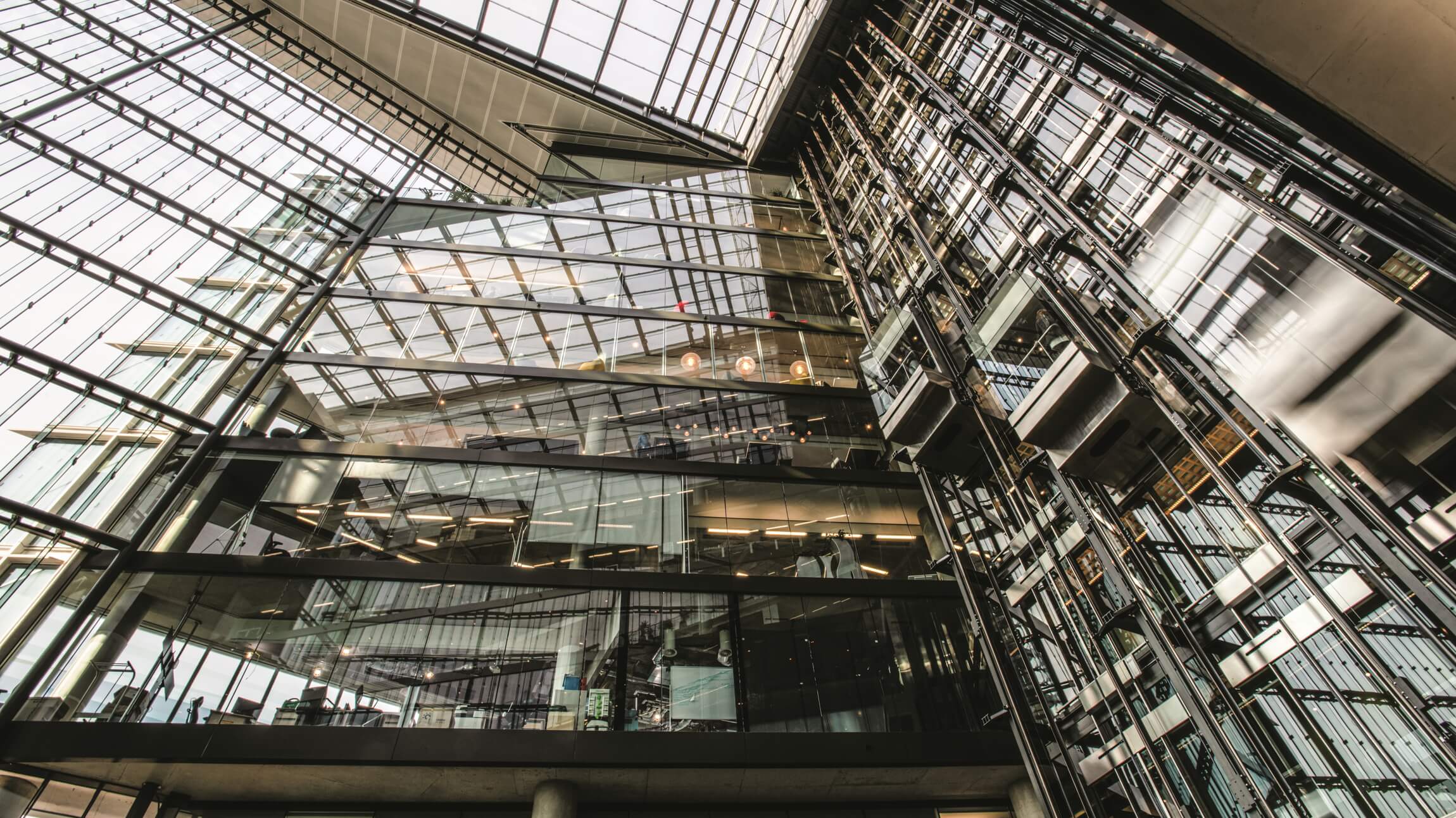 This inside of a Microsoft building looking up from the lobby at a series of offices and balconies.
